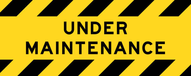 under maintenence Yellow and black color with line striped label banner with word under maintenance